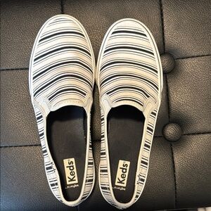 Keds White and Black Canvas Slip-On Sneakers